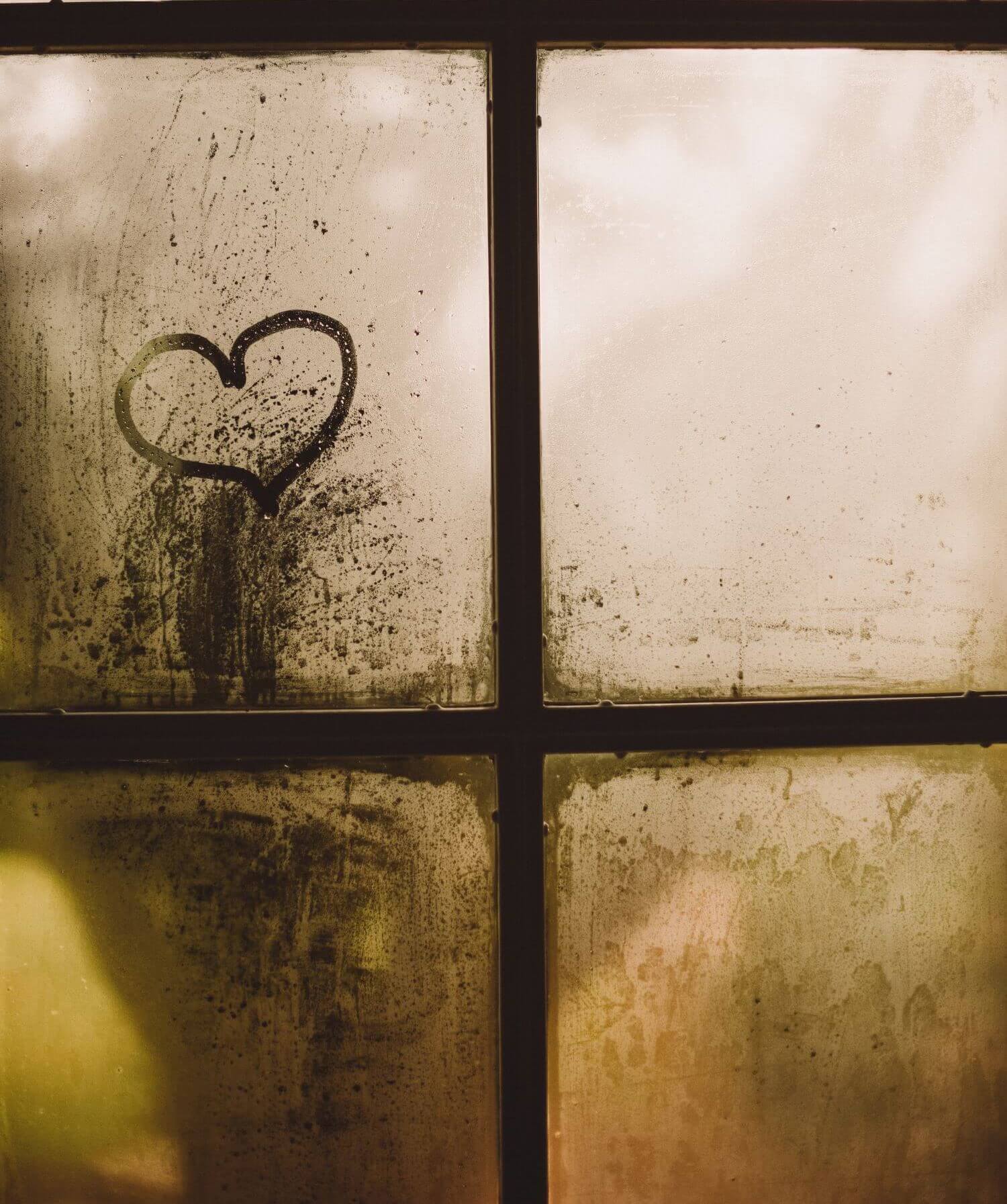 Image of a steamy window with a heart traced into the condensation. This photo illustrates the love that couples can find during marriage counseling in Los Angeles, CA. In fact, a couples therapist in Los Angeles, CA can help you manage life transitions and more. | 90404 | 90503
