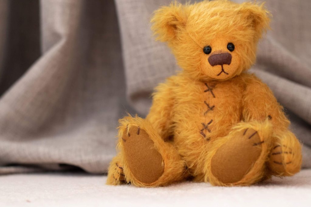 Image of a yellow sad looking teddy bear. This image depicts the sadness that parents in postpartum therapy in Los Angeles, CA may be feeling. | 90504 | 90505