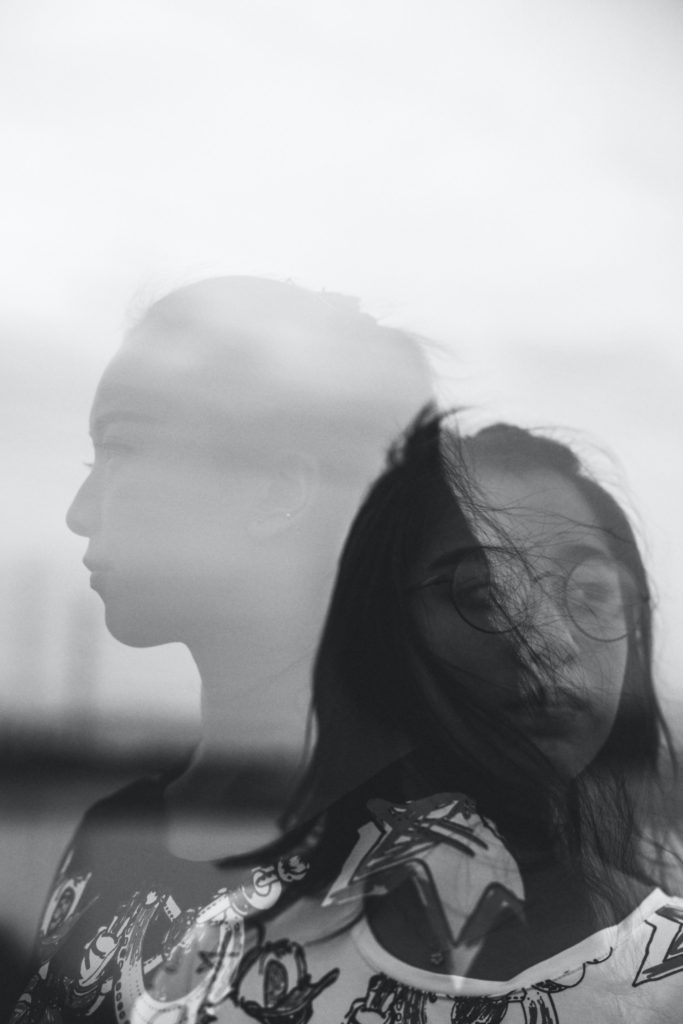Asian American Woman in Black and White. If you are struggling with the asian american experience, our asian therapists in Los Angeles, CA can help. We have therapy for asian women in Los Angeles, CA. (90404, 90503, 91006.)