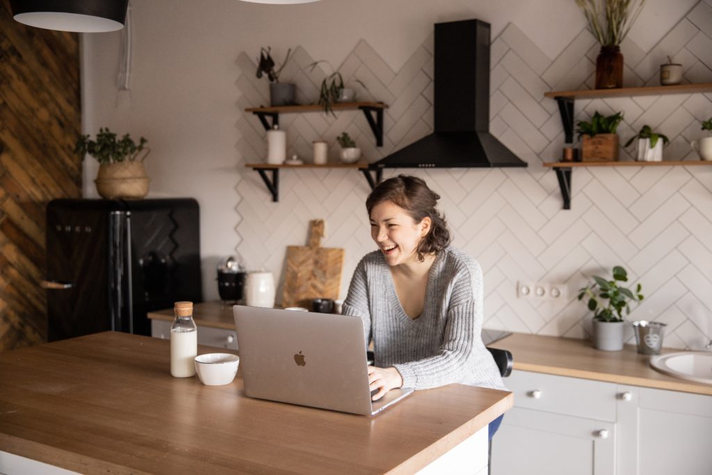 A woman working on her laptop. This could represent searching for online anxiety treatment in California. Search for asian american therapist near me for support with EMDR therapy in Los Angeles, CA today.