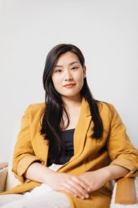 An Asian professional representing the culturally competent therapists represented at Yellow Chair Collective in Los Angeles, California.