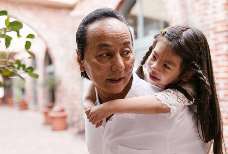 Grandfather and granddaughter representing our there can be appropriate boundaries within Asian American households to form closer bonds and have healthier mental health in the Los Angeles, California area.