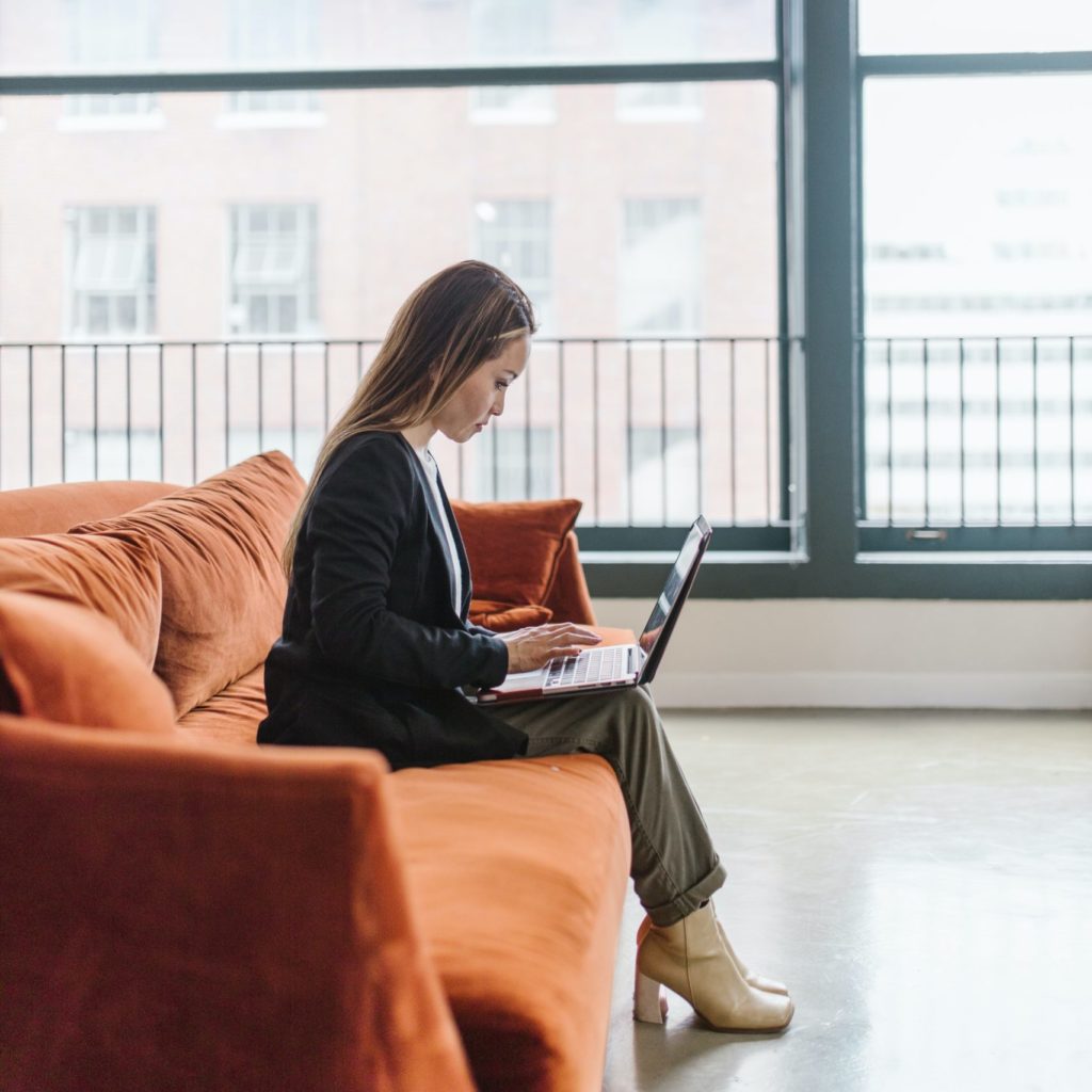 Asian American woman receiving therapy online representing the increase in online therapy usage in the state of New York.