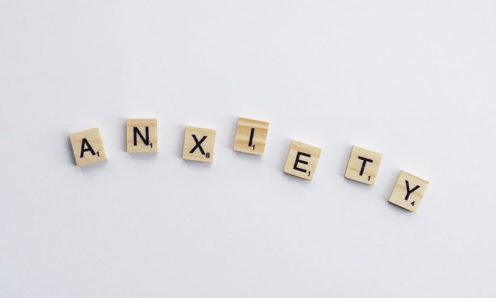 Anxiety spelled out with scrabble letters representing how many people struggle with anxiety and that New York City therapists have the ability to help clients deal, manage, and treatment anxiety and its symptoms.