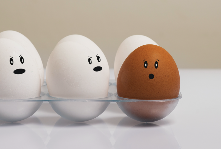 A carton of eggs with different emotion faces to represent the spectrum of emotions that we can feel as humans. The Asian American Emotion Management Coaching group can teach people how to cope with difficult feelings.