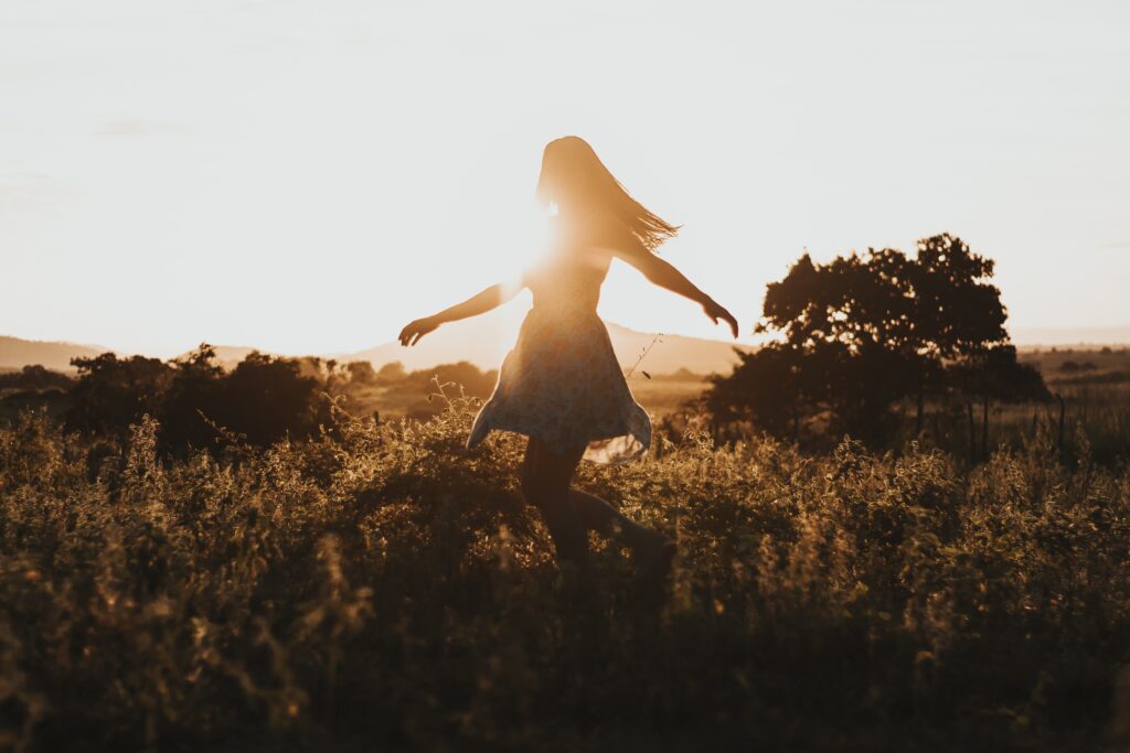 A woman dances and spins in a field in the light of the rising sun. This could represent the benefits of receiving support for sensitive teens. Learn more about the support therapy for teens in Los Angeles, CA can offer by contacting therapy for HSP in Los Angeles, CA. Search for online therapy for teens in California to learn more.