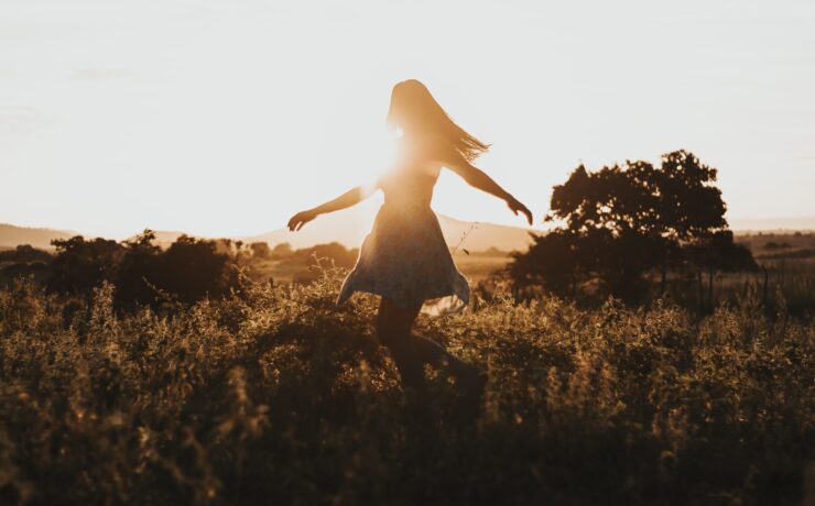 A woman dances and spins in a field in the light of the rising sun. This could represent the benefits of receiving support for sensitive teens. Learn more about the support therapy for teens in Los Angeles, CA can offer by contacting therapy for HSP in Los Angeles, CA. Search for online therapy for teens in California to learn more.