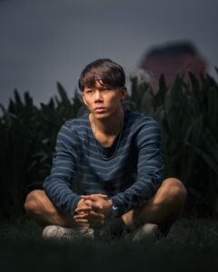 An asian american teen sits alone with a concernened expression. This could represent the isolation felt that an Asian therapist in Los Angeles, CA can address. Learn more about online therapy for teens in California or contact an Asian therapist in New York for the help you deserve.
