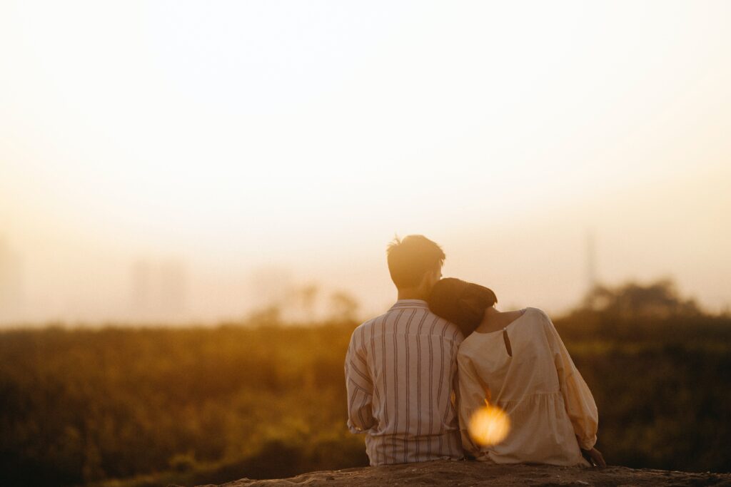 A couple sit next to one another while taking in the setting sun. This could symbolize the bonds cultivated with online couples therapy in California. Learn how an Asian American therapist in California can offer suport with dating. Search for an Asian therapist in Los Angeles, CA today.