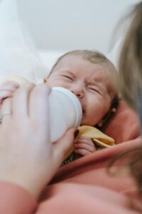 A close up of a mother feeding their crying baby. This could represent the function of anger in people. Learn how individual therapy in Los Angeles, CA can offer support with understanding emotions remotely. Search for online therapy in Los Angeles, CA and how an Asian therapist in Los Angeles, CA can help.
