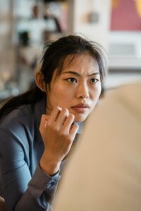 A woman appears upset while talking with a person sitting in front of them. Learn how an Asian American therapist in California can offer support with individual therapy in Los Angeles, CA and other services. Search for anxiety treatment in Los Angeles, CA and how online therapy can offer remote support.
