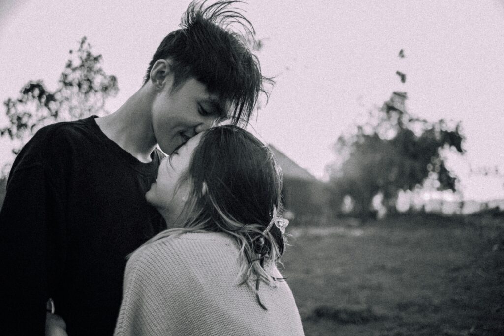A close up of a couple smiling and embracing one another. Learn how online couples therapy in California can offer support by contacting an Asian American therapist in California today. Search for couples therapy and marriage counseling in Los Angeles, CA today.