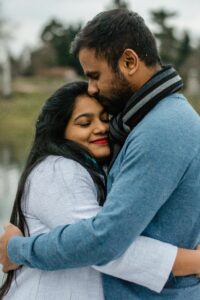 A couple smile while embracing one another. This could represent the bonds cultivated from online couples therapy in California. Learn more about marriage counseling in Los Angeles, CA and how couples therapy and marriage counseling in Los Angeles, CA today. 
