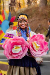 A woman smiles at the camera while wearing a traditional filipino dress. Learn more about how an Asian American therapist in California can offer support by contacting a culturally sensitive therpaist Los Angeles, CA. They can offer cultuarlly sensitive therapy in New York and across California. 
