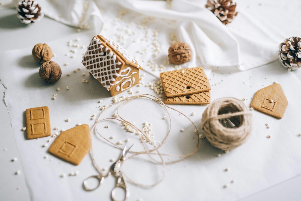 A close up of a gingerbread house and materials for a second home. Learn how a neurodiversity-affirming therapist in Los Angeles, CA can offer support during the holiday season. Search for neurodiverse affirming therapy Los Angeles, CA and how an online therapist in Los Angeles, CA can help.