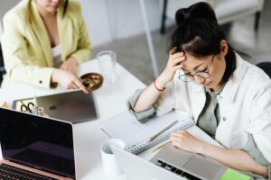 stressed woman working | burnout therapist in los angeles, ca | anxiety treatment in los angeles, ca | individual therapy in los angeles, ca | 90048 | 91502