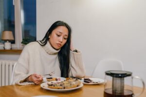 disappointed looking millennial woman eating pizookie dessert