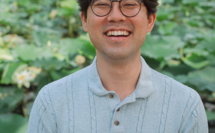 smiling Asian American male therapist