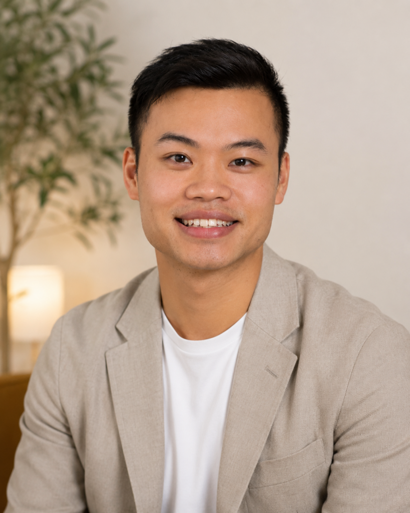 Headshot of an Asian American male life coach