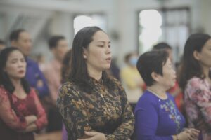 pexels-huynh-van-75710069-8582732 A group of Asian women in traditional clothing at what seems to be a religious gathering