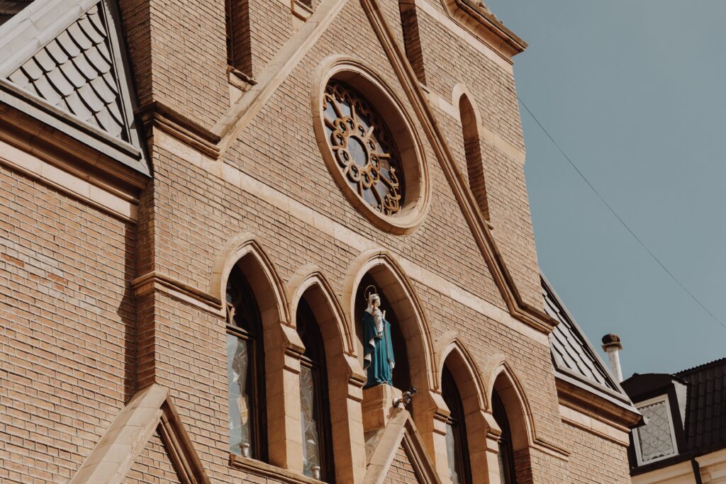 A cathedral built of red bricks against the sky