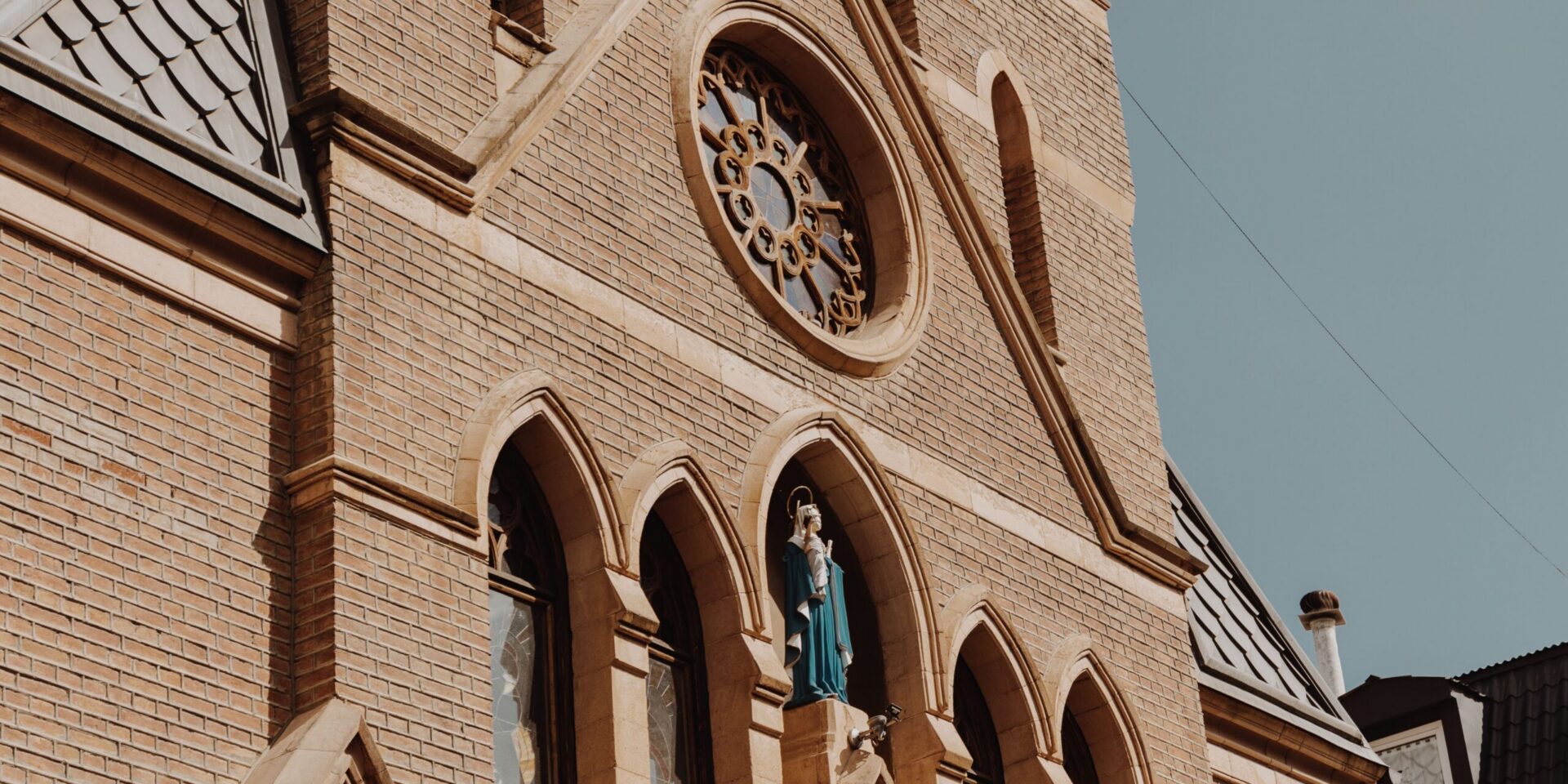 A cathedral built of red bricks against the sky