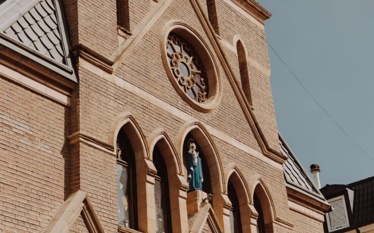 A cathedral built of red bricks against the sky