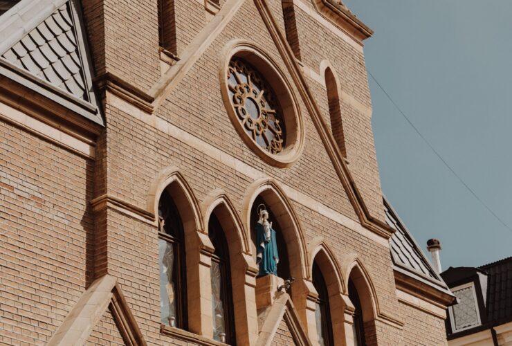 A cathedral built of red bricks against the sky